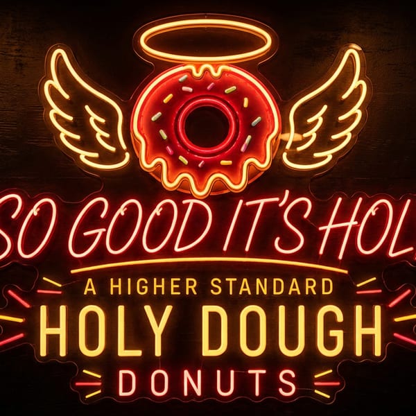 Glowing neon sign featuring a winged, haloed donut above the words “So Good It’s Holy” and “Holy Dough Donuts.”